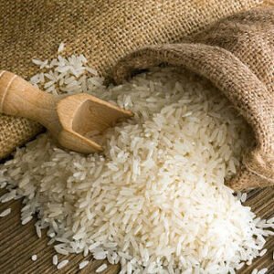 white uncooked rice in small burlap sack
